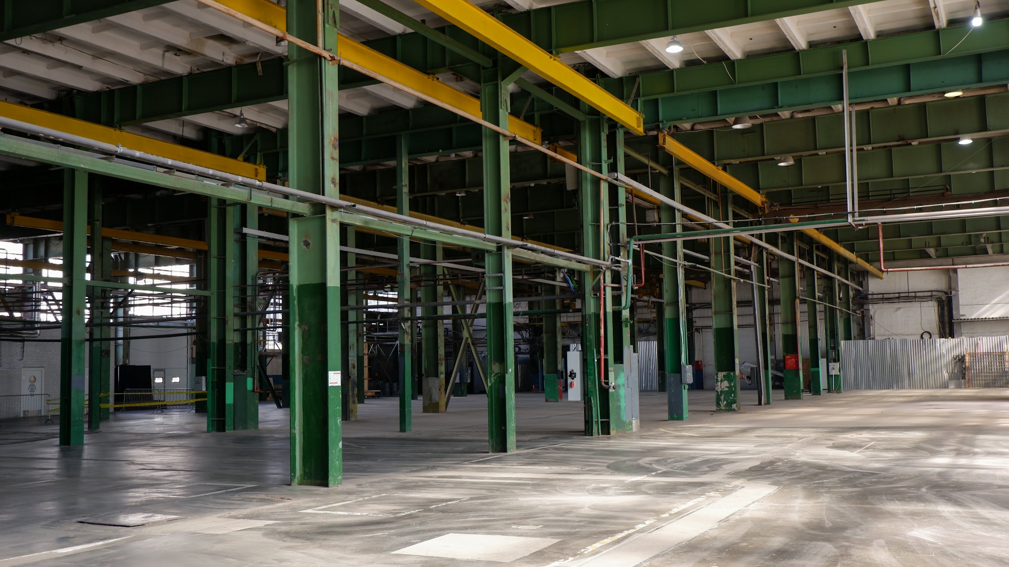 The inside of a large, empty factory hall